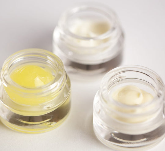 Thee different sensitive skincare products in glass sample pots